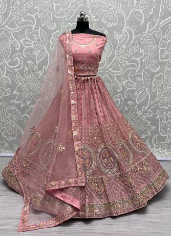 For A Fancy Designer Look,Grab These Lehenga Choli With Dupatta in Fine Colored.These Lehenga And Choli Are Net And Dupatta Are Fabricated On Soft Silk Pair.Its Beautified With Designer Thread,Sequance,Dori Embroidery,Zarkan Diamond Work.