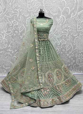 For A Fancy Designer Look,Grab These Lehenga Choli With Dupatta in Fine Colored.These Lehenga And Choli Are Net And Dupatta Are Fabricated On Soft Silk Pair.Its Beautified With Designer Thread,Sequance,Dori Embroidery,Zarkan Diamond Work.