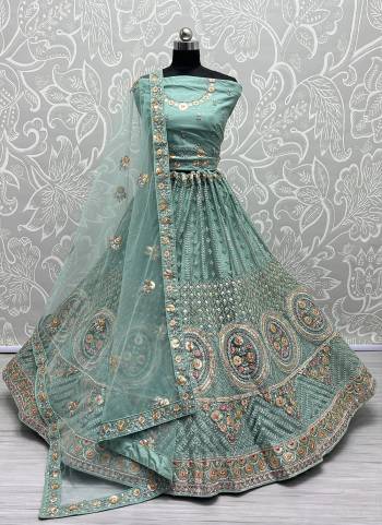 For A Fancy Designer Look,Grab These Lehenga Choli With Dupatta in Fine Colored.These Lehenga And Choli Are Net And Dupatta Are Fabricated On Soft Silk Pair.Its Beautified With Designer Thread,Sequance,Dori Embroidery,Zarkan Diamond Work.