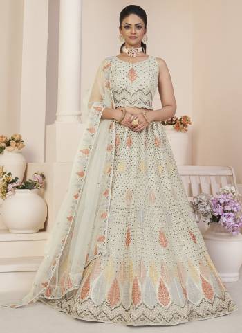 For A Fancy Designer Look,Grab These Lehenga Choli With Dupatta in Fine Colored.These Lehenga And Choli Are Net And Dupatta Are Fabricated On Net Pair.Its Beautified With Designer Thread,Sequance Embroidery Work.