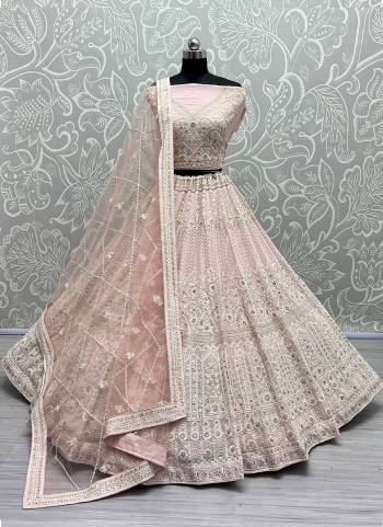 For A Fancy Designer Look,Grab These Lehenga Choli With Dupatta in Fine Colored.These Lehenga And Choli Are Net And Dupatta Are Fabricated On Soft Net Pair.Its Beautified With Designer Multy Thread,Dori Embroidery With Diamond Work.