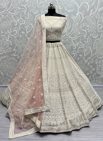 For A Fancy Designer Look,Grab These Lehenga Choli With Dupatta in Fine Colored.These Lehenga And Choli Are Net And Dupatta Are Fabricated On Soft Net Pair.Its Beautified With Designer Multy Thread,Dori Embroidery With Diamond Work.