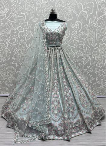 For A Fancy Designer Look,Grab These Lehenga Choli With Dupatta in Fine Colored.These Lehenga And Choli Are Net And Dupatta Are Fabricated On Soft Silk Pair.Its Beautified With Designer Thread,Sequance,Dori Embroidery,Zarkan Diamond Work.