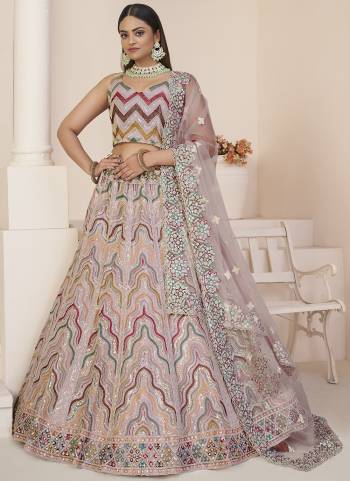 For A Fancy Designer Look,Grab These Lehenga Choli With Dupatta in Fine Colored.These Lehenga And Choli Are Net And Dupatta Are Fabricated On Net Pair.Its Beautified With Designer Thread,Sequance Embroidery,Stone Work.