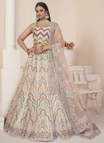 For A Fancy Designer Look,Grab These Lehenga Choli With Dupatta in Fine Colored.These Lehenga And Choli Are Net And Dupatta Are Fabricated On Net Pair.Its Beautified With Designer Thread,Sequance Embroidery,Stone Work.