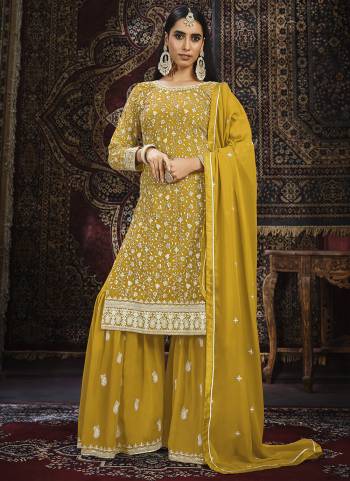 Grab These Designer Suit in Fine Colored Pair With Bottom And Dupatta.These Top And Dupatta Are Fabricated On Faux Georgette Pair With Faux Georgette Bottom.Its Beautified With Santoon Inner.Its Beautified With Heavy Designer Embroidery Work.