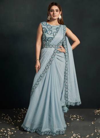 Look Attrective These Designer Party Wear Saree in Fine Light Colored.These Saree Are Pattern Jari Georgette And Blouse Banglori Silk is Fabricated.Its Beautified Solid With Cord Sequance,Thread Embroidery,Additional Work.