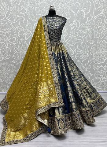 For A Fancy Designer Look,Grab These Lehenga Choli With Dupatta in Fine Colored.These Lehenga And Choli Are Banarasi Silk And Dupatta Are Fabricated On Banarasi Silk Pair.Its Beautified With Wevon Designer With Meenakari Hand  Diamond Work.