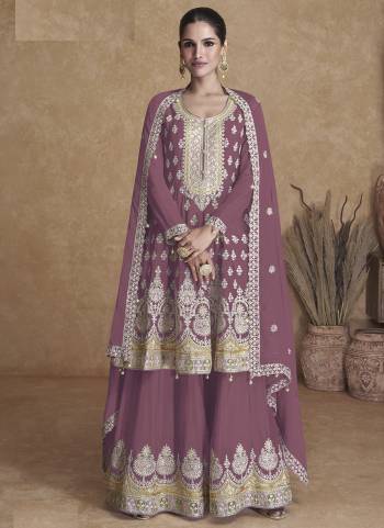 Garb These Designer Plazzo Suits in Fine Colored Pair With Dupatta.These Top And Dupatta Are Fabricated On Faux Georgette Pair With Faux Georgette Bottom.Its Beautified With Heavy Designer Floral Embroidery Work.