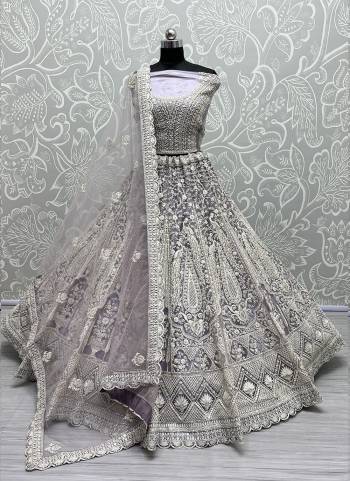 For A Fancy Designer Look,Grab These Lehenga Choli With Dupatta in Fine Colored.These Lehenga And Choli Are Net And Dupatta Are Fabricated On Soft Net Pair.Its Beautified With Designer Thread,Dori Embroidery, Diamond Work.