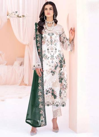 White colored pakistani suit is prettified with floral embroidered with sequins work as shown which makes it appear classy. This top is made of georgette fabric which is accompanied with santoon bottom, santoon lining and Nazmin Chiffon dupatta. Women can buy this suit to wear for their parties and functions.