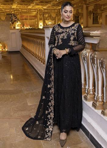 Black colored pakistani suit is prettified with sequins and Embroidery work as shown which makes it appear classy. This top is made of georgette fabric which is accompanied with santoon bottom, santoon lining and Nazmin Chiffon dupatta. Women can buy this suit to wear for their parties, functions and event.