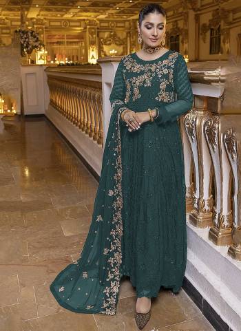 GREEN colored pakistani suit is prettified with sequins and Embroidery work as shown which makes it appear classy. This top is made of georgette fabric which is accompanied with santoon bottom, santoon lining and Nazmin Chiffon dupatta. Women can buy this suit to wear for their parties, functions and event.