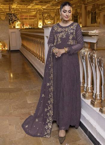 MAUVE colored pakistani suit is prettified with sequins and Embroidery work as shown which makes it appear classy. This top is made of georgette fabric which is accompanied with santoon bottom, santoon lining and Nazmin Chiffon dupatta. Women can buy this suit to wear for their parties, functions and event.