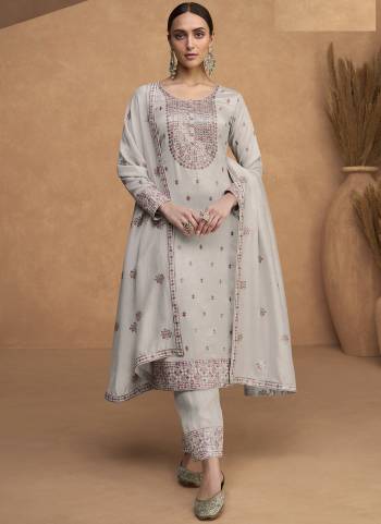 Grey colored Straight suit is prettified with floral embroidered as shown which makes it appear classy. This top is made of Premium Silk fabric which is accompanied with Santoon bottom and Premium Silk dupatta. Women can buy this suit to wear for their parties, festive and functions.