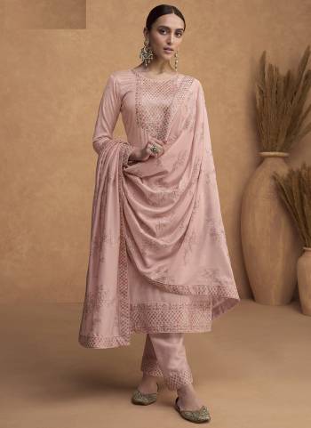 Peach colored Straight suit is prettified with floral embroidered as shown which makes it appear classy. This top is made of Premium Silk fabric which is accompanied with Santoon bottom and Premium Silk dupatta. Women can buy this suit to wear for their parties, festive and functions.