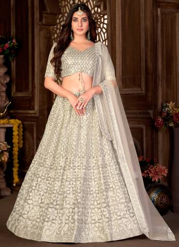 Grab These Beautiful Colored Lehenga Choli.These Lehenga and Dupatta Are Fabricated On Net Pair With Net Blouse.Its Beautified With Heavy Thread,Sequance Embroidery Work.