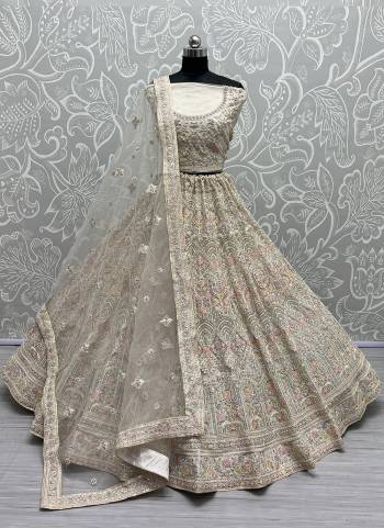 For A Fancy Designer Look,Grab These Lehenga Choli With Dupatta in Fine Colored.These Lehenga And Choli Are Net And Dupatta Are Fabricated On Soft Net Pair.Its Beautified With Designer Thread,Dori Embroidery, Diamond Work.