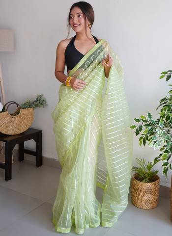 Attrective Looking These Party Wear Saree in Fine Colored.These Saree Are Organza And Blouse is Fabricated On Art Silk.Its Beautified With Designer Gota Lace Work.