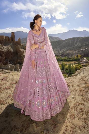 For A Designer Look,Grab These Lehenga Choli in Fine Colored.These Lehenga And Blouse Are Fabricated On Organza Pair With Net Dupatta.Its Beautified With Designer Mirror Embroidery Cut Work With Zarkan Work.