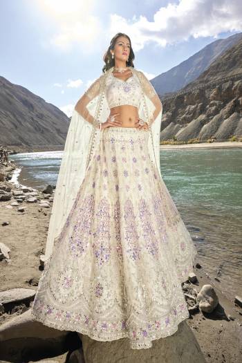 For A Designer Look,Grab These Lehenga Choli in Fine Colored.These Lehenga And Blouse Are Fabricated On Net Pair With Net Dupatta.Its Beautified With Designer Mirror Embroidery Cut Work With Zarkan Work.