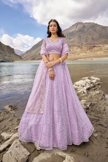 For A Designer Look,Grab These Lehenga Choli in Fine Colored.These Lehenga And Blouse Are Fabricated On Net Pair With Net Dupatta.Its Beautified With Designer Mirror Embroidery Cut Work With Zarkan Work.