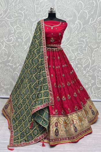 For A Fancy Designer Look,Grab These Lehenga Choli With Dupatta in Fine Colored.These Lehenga And Choli Are Gadhawal Silk And Dupatta Are Fabricated On Chiffon Pair.Its Beautified With Designer Printed,Jari Sequance Embroidery,Zarkan Diamond Work.