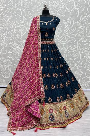 For A Fancy Designer Look,Grab These Lehenga Choli With Dupatta in Fine Colored.These Lehenga And Choli Are Gadhawal Silk And Dupatta Are Fabricated On Chiffon Pair.Its Beautified With Designer Printed,Jari Sequance Embroidery,Zarkan Diamond Work.