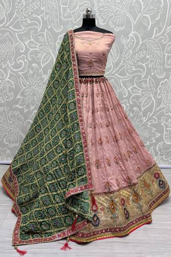 For A Fancy Designer Look,Grab These Lehenga Choli With Dupatta in Fine Colored.These Lehenga And Choli Are Gadhawal Silk And Dupatta Are Fabricated On Chiffon Pair.Its Beautified With Designer Printed,Jari Sequance Embroidery,Zarkan Diamond Work.