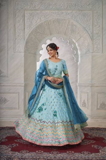 For A Fancy Designer Look,Grab These Lehenga Choli With Dupatta in Fine Colored.These Lehenga And Choli Are Shibori Crepe And Dupatta Are Fabricated On Net Pair.Its Beautified With Designer Mirror,Jari Embroidery,Stone Work.