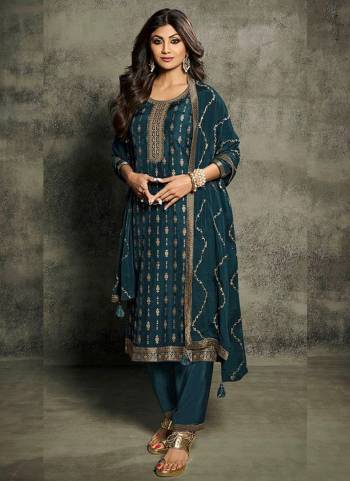 Garb These Designer Suit in Fine Colored Pair With Bottom And Dupatta.These Top Are Jacquard Silk And Dupatta Are Fabricated On Chinon Silk Pair With Santoon Bottom.Its Beautified With Dull Santoon Inner.Its Beautified With Wevon Jacquard Designer, Embroidery Work.