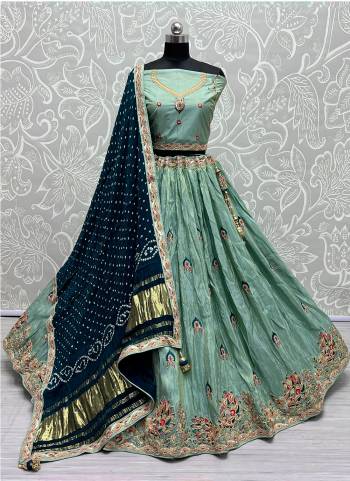 For A Fancy Designer Look,Grab These Lehenga Choli With  Dupatta in Fine Colored.These Lehenga And Choli Dolla Silk And Dupatta Are Fabricated On Gajji Silk.Its Beautified With Designer Sequance,Jari Embroidery,Zarkan Diamond Work.