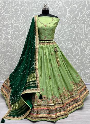 For A Fancy Designer Look,Grab These Lehenga Choli With  Dupatta in Fine Colored.These Lehenga And Choli Dolla Silk And Dupatta Are Fabricated On Gajji Silk.Its Beautified With Designer Sequance,Jari Embroidery,Zarkan Diamond Work.