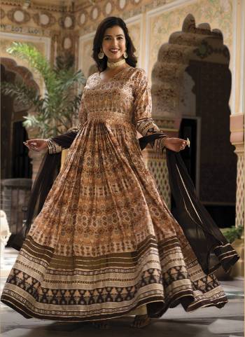 For A Designer Look,Grab These Readymade Gown With Dupatta in Fine Colored.These Gown Are Fabricated On Dola Silk Pair With Chinon Dupatta.Its Beautified With Designer Digital Printed With Hand Work.