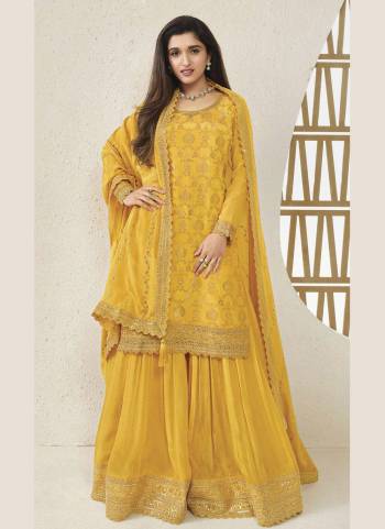 Attrective Looking These Party Wear Sharara Suit in Fine Colored Pair With Bottom And Dupatta.These Top And Dupatta Are Fabricated On Viscose Chinon Jacquard Pair With Viscose Chinon Bottom.Its Beautified With Wevon Jacquard Designer With Embroidery Work.