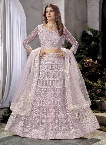 Grab These Beautiful Colored Lehenga Choli.These Lehenga and Dupatta Are Fabricated On Net Pair With Net Blouse.Its Beautified With Heavy Embroidery Work.