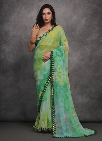 Grab These Festive Wear Saree in Fine Colored.These Saree is Fabricated On Georgette Pair With Satin Gotta Blouse.Its Beautified Designer Prizam Printed With Mirror Work Lace Border.