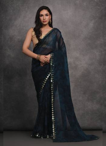 Grab These Festive Wear Saree in Fine Colored.These Saree is Fabricated On Georgette Pair With Satin Gotta Blouse.Its Beautified Designer Prizam Printed With Mirror Work Lace Border.