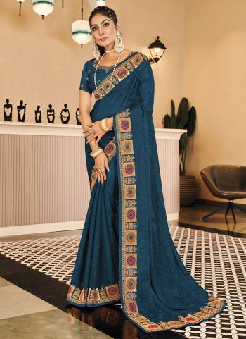 Garb These Fancy Party Wear Saree in Fine Colored.These Saree Are Shimmer And Blouse is Fabricated On Fancy Art Silk Pair.Its Beautified With Blooming Color,Heavy Embroidery, Swarovski Work.