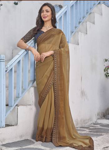 Garb These Fancy Saree in Fine Colored.These Saree Are Shimmer And Blouse is Fabricated On Art Silk Pair.Its Beautified With Pedding Color With Embroidery Work Border Blouse Disigner.