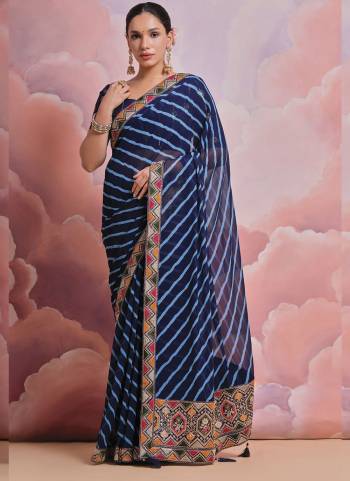 Grab These Festive Wear Saree in Fine Colored.These Saree is Fabricated On Georgette Pair With Mono Banglori Blouse.Its Beautified Designer Laheriya Printed With Multy Thread,Sequance,Coding Work Lace Border With Blouse.