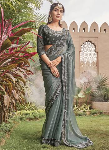 Looking These Fancy Party Wear Saree in Fine Colored.These Saree Are Shimmer And Blouse is Fabricated On Art Silk Pair.Its Beautified With Blooming Color With Heavy Embroidery Work Border Blouse.