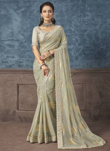 Look Attrective These Designer Party Wear Saree in Fine Light Colored.These Saree Are Georgette And Blouse Raw Silk is Fabricated.Its Beautified Heavy Wevon Designer With Embroidery Work.