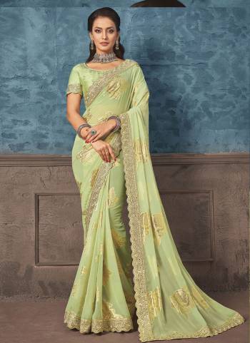 Look Attrective These Designer Party Wear Saree in Fine Light Colored.These Saree Are Georgette And Blouse Raw Silk is Fabricated.Its Beautified Heavy Wevon Designer With Embroidery Work.