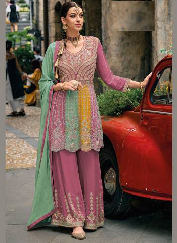 Garb These Designer Sharara Suits in Fine Colored Pair With Dupatta.These Top And Dupatta Are Fabricated On Chinon Pair With Chinon Bottom.Its Beautified With Heavy Designer Embroidery Work