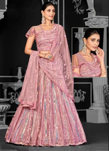 For A Designer Look,Grab These Lehenga Choli in Fine Colored.These Lehenga And Dupatta Are Fabricated On Net Pair With Net Blouse.Its Beautified With Designer Cord Floral Sequance Embroidery With Applique Work.