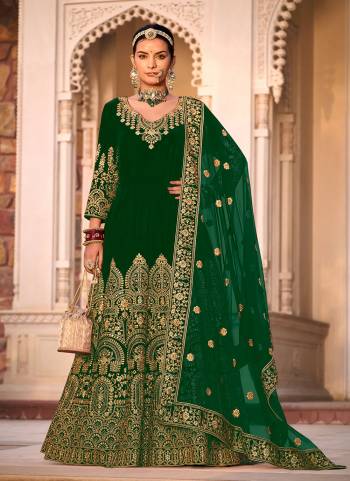 Garb These Anarkali Suit in Fine Colored Pair With Bottom And Dupatta.These Top Are Velvet And Dupatta Are Fabricated On Butterfly Net Pair With Micro Bottom.Its Beautified With Designer Heavy Jari Embroidery Work.