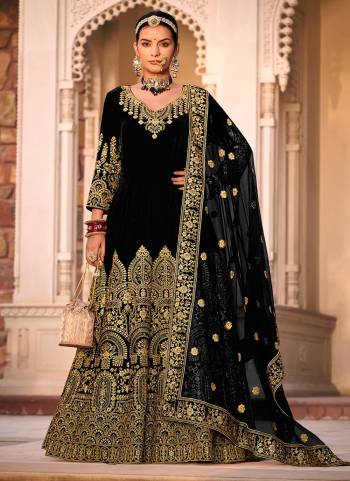 Garb These Anarkali Suit in Fine Colored Pair With Bottom And Dupatta.These Top Are Velvet And Dupatta Are Fabricated On Butterfly Net Pair With Micro Bottom.Its Beautified With Designer Heavy Jari Embroidery Work.