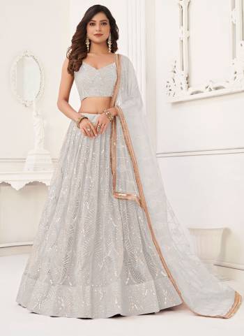 For A Different Look,Grab These Party Wear Designer Lehenga in All Over Pretty Colored Pair With Blouse And Dupatta.These Lehenga Choli And Dupatta is All Over Butterfly Net Base Fabric With Designer Thread,Sequance,Real Mirror Embroidery Work.