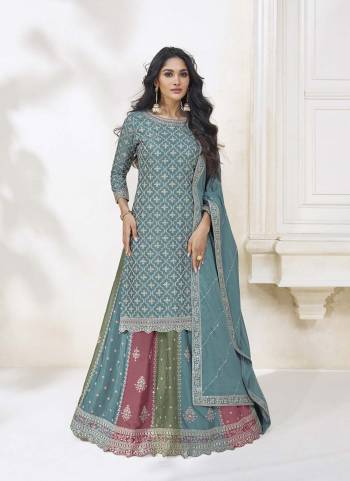 Garb These Designer Sharara Suits in Fine Colored Pair With Dupatta.These Top And Dupatta Are Fabricated On Chinon Pair With Chinon Bottom.Its Beautified With Heavy Designer Embroidery Work